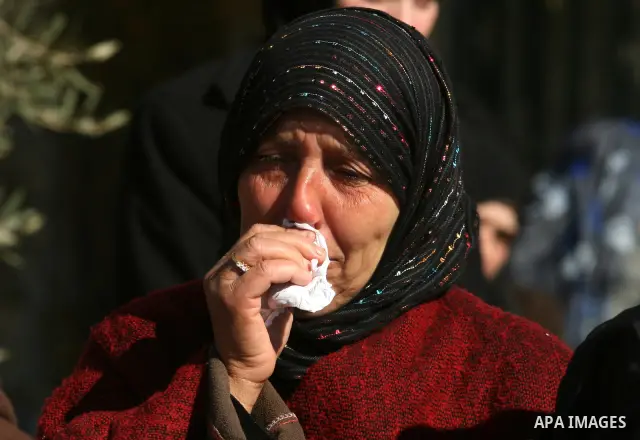 Relatives mourn during the funeral of Palestinian activist Mustafa al-Tamimi in the West Bank village of Nabi Saleh on December 11, 2011. Tamimi, 28, was hurling rocks at an Israeli military vehicle on Friday in the West...