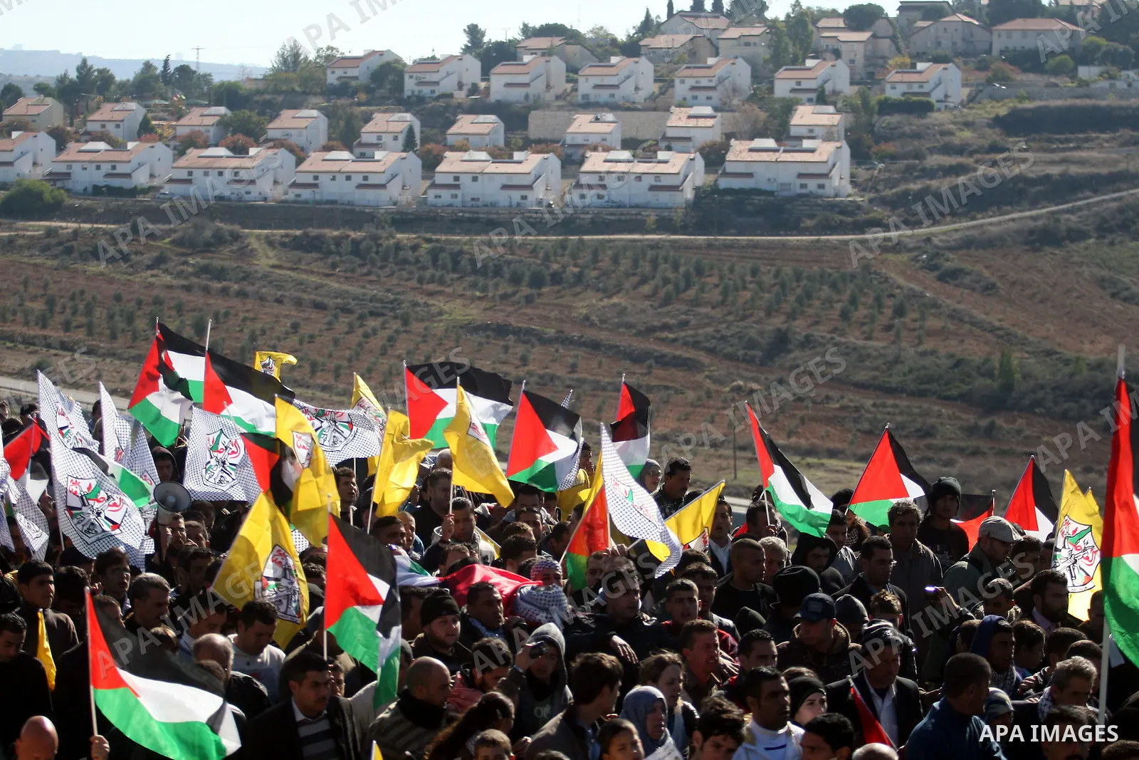Palestinians carry the body of Mustafa Tamimi during his funeral in the West Bank city of Ramallah, Sunday, Dec. 11, 2011. Tamini, 28, was hurling rocks at an Israeli military vehicle on Friday in the West Bank village o...