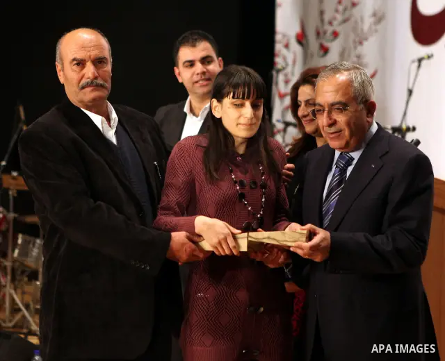 Palestinian Prime Minister, Salam Fayyad attends a celebration to honor volunteers in the West Bank city of Nablus, Sunday , Dec. 11, 2011. Photo by Mustafa Abu Dayeh