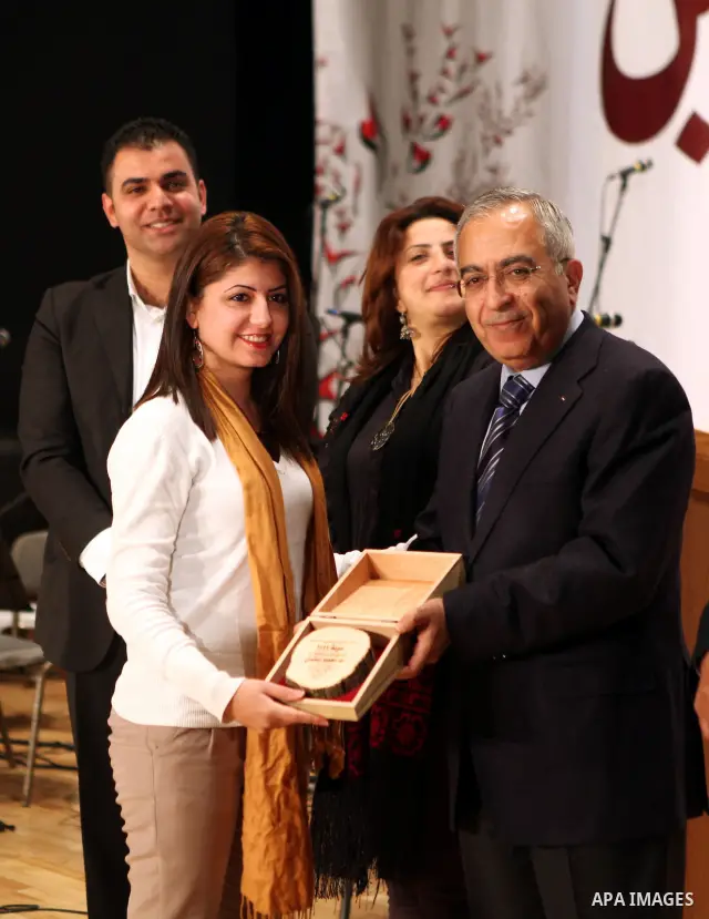 Palestinian Prime Minister, Salam Fayyad attends a celebration to honor volunteers in the West Bank city of Nablus, Sunday , Dec. 11, 2011. Photo by Mustafa Abu Dayeh
