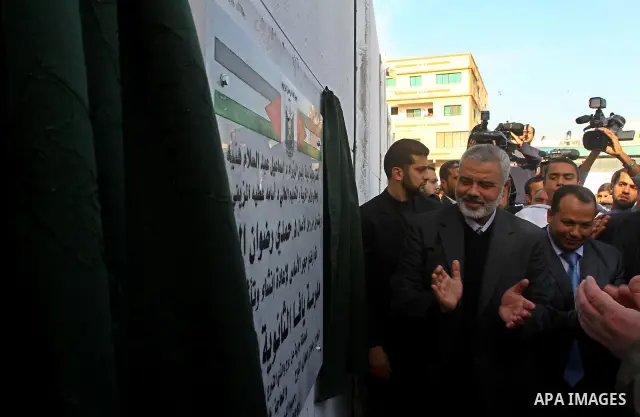 Palestinian Prime Minister in Gaza, Ismail Haniya, lays foundation stone for the reconstruction of yafa secondary school in the neighborhood Al tofah in Gaza city on Dec.13, 2011. Photo by Ashraf Amra