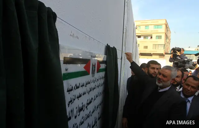 Palestinian Prime Minister in Gaza, Ismail Haniya, lays foundation stone for the reconstruction of yafa secondary school in the neighborhood Al tofah in Gaza city on Dec.13, 2011. Photo by Ashraf Amra