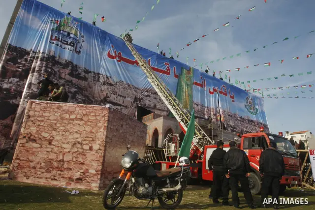 Palestinian members of Hamas prepare the court of "Qatiba" for the celebrations marking the Islamist movement's 24th founding anniversary, in Gaza city on Dec 13,2011. The main celebration will be held on December 14, th...