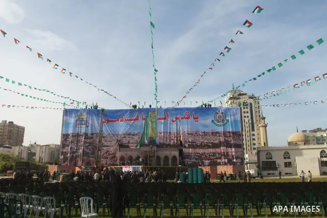 Palestinian members of Hamas prepare the court of "Qatiba" for the celebrations marking the Islamist movement's 24th founding anniversary, in Gaza city on Dec 13,2011. The main celebration will be held on December 14, th...