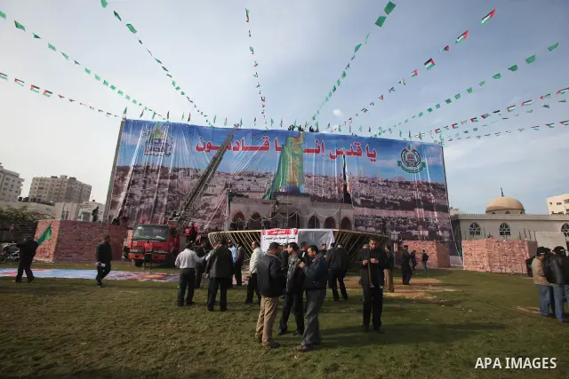 Palestinian members of Hamas prepare the court of "Qatiba" for the celebrations marking the Islamist movement's 24th founding anniversary, in Gaza city on Dec 13,2011. The main celebration will be held on December 14, th...