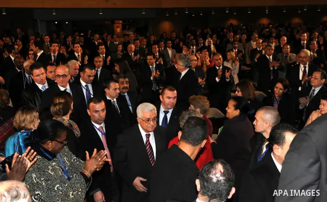 Palestinian President Mahmoud Abbas attends the Palestinian flag raising ceremony, at the UNESCO headquarters in Paris, Tuesday Dec. 13, 2011. Palestine was admitted as a member of the U.N. Educational, Scientific and Cu...