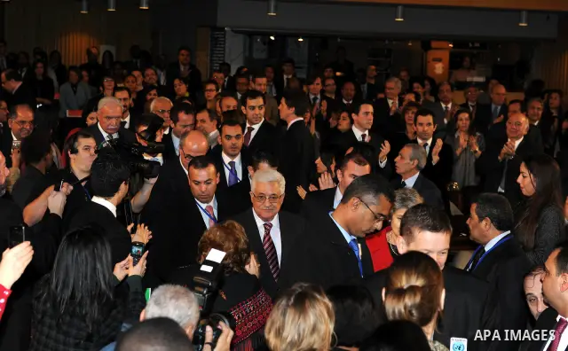 Palestinian President Mahmoud Abbas attends the Palestinian flag raising ceremony, at the UNESCO headquarters in Paris, Tuesday Dec. 13, 2011. Palestine was admitted as a member of the U.N. Educational, Scientific and Cu...