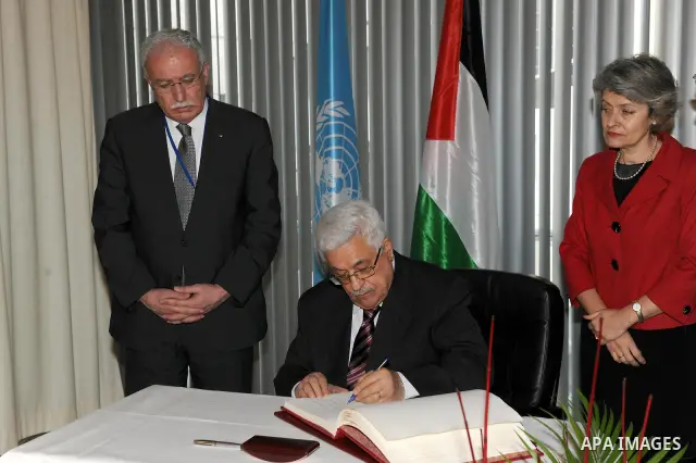 Palestinian President Mahmoud Abbas attends the Palestinian flag raising ceremony, at the UNESCO headquarters in Paris, Tuesday Dec. 13, 2011. Palestine was admitted as a member of the U.N. Educational, Scientific and Cu...