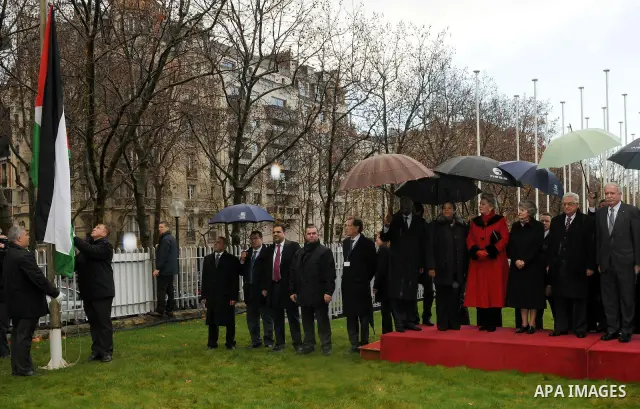 Palestinian President Mahmoud Abbas attends the Palestinian flag raising ceremony, at the UNESCO headquarters in Paris, Tuesday Dec. 13, 2011. Palestine was admitted as a member of the U.N. Educational, Scientific and Cu...