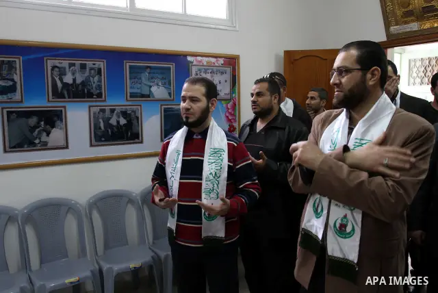 Members of al-Wa'ad team for Nasheed visit the home of Hamas leader Ahmed Yassen in preparation for the celebrations marking the Islamist movement's 24th anniversary, in Gaza city on Dec. 13,2011. The main celebration wi...