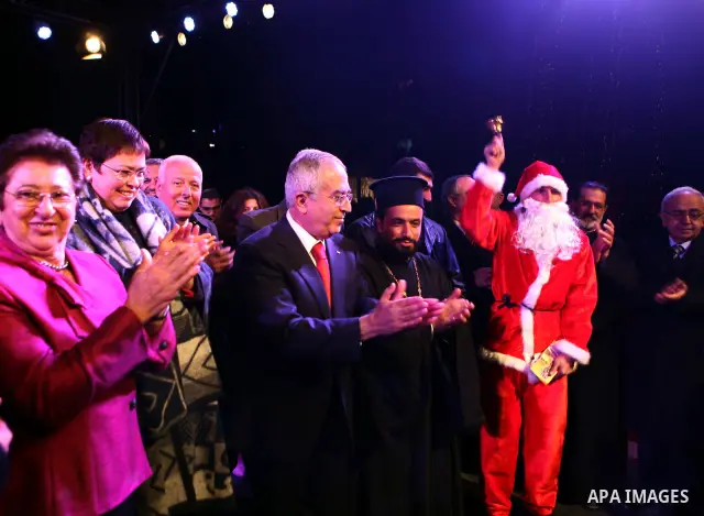 Palestinian Prime Minister, Salam Fayyad, during a ceremony of lighting the Christmas tree, in the West Bank City of Ramallah, On Dec.13, 2011. Photo by Mustafa Abu Dayeh