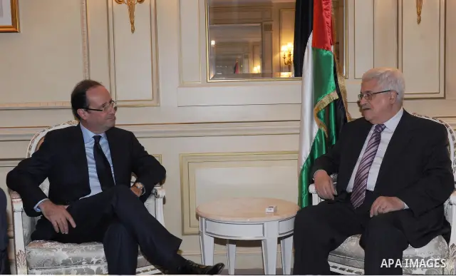 Palestinian President Mahmoud Abbas (Abu Mazen) meets with of the Socialist Party candidate for the presidential election In the French capital Paris, On Dec. 13, 2011. Photo by Thaer Ganaim