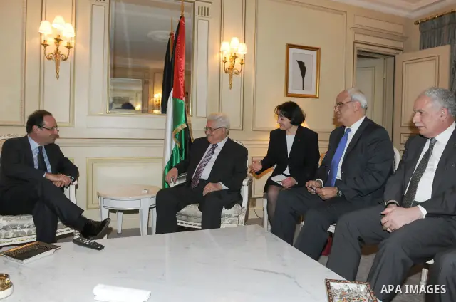 Palestinian President Mahmoud Abbas (Abu Mazen) meets with of the Socialist Party candidate for the presidential election In the French capital Paris, On Dec. 13, 2011. Photo by Thaer Ganaim