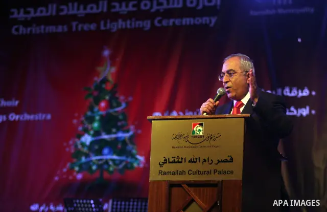 Palestinian Prime Minister, Salam Fayyad, during a ceremony of lighting the Christmas tree, in the West Bank City of Ramallah, On Dec.13, 2011. Photo by Issam Rimawi