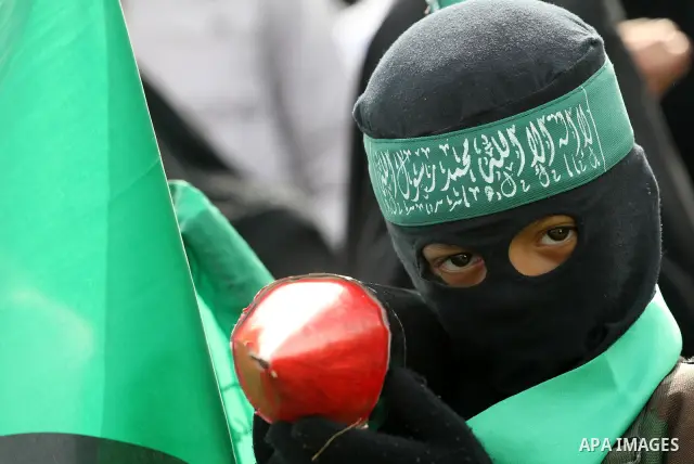 Thousands of Hamas supporters gather to celebrating marking the Islamist movement's 24nd anniversary at el-Qatiba yard in Gaza city on Dec 14, 2011. the Islamist movement of Hamas take over ruling at Gaza strip since Jun...