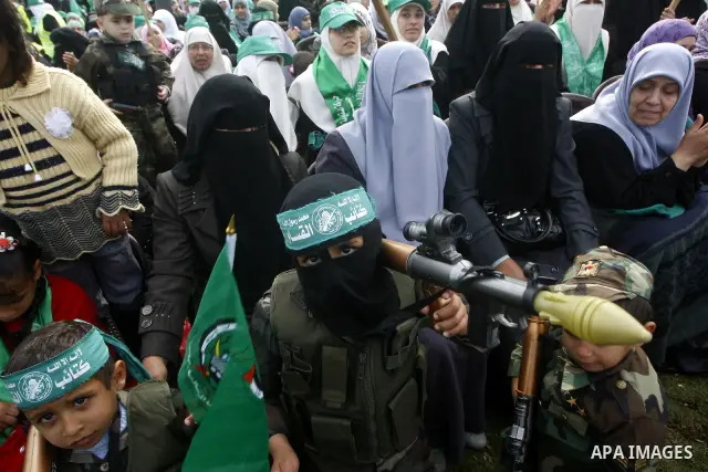Thousands of Hamas supporters gather to celebrating marking the Islamist movement's 24nd anniversary at el-Qatiba yard in Gaza city on Dec 14, 2011. the Islamist movement of Hamas take over ruling at Gaza strip since Jun...