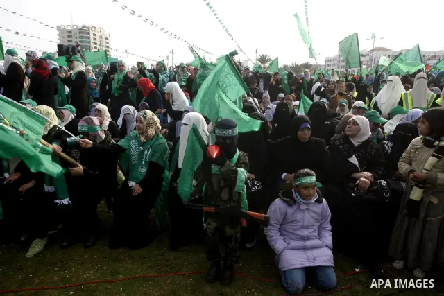 Thousands of Hamas supporters gather to celebrating marking the Islamist movement's 24nd anniversary at el-Qatiba yard in Gaza city on Dec 14, 2011. the Islamist movement of Hamas take over ruling at Gaza strip since Jun...