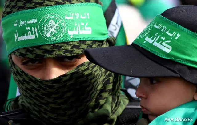 Thousands of Hamas supporters gather to celebrating marking the Islamist movement's 24nd anniversary at el-Qatiba yard in Gaza city on Dec 14, 2011. the Islamist movement of Hamas take over ruling at Gaza strip since Jun...