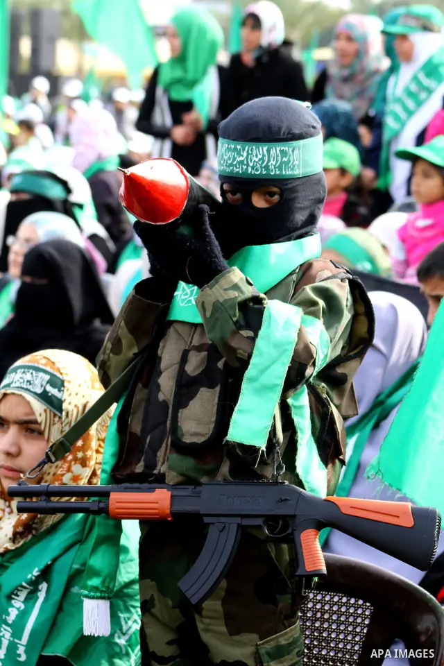 Thousands of Hamas supporters gather to celebrating marking the Islamist movement's 24nd anniversary at el-Qatiba yard in Gaza city on Dec 14, 2011. the Islamist movement of Hamas take over ruling at Gaza strip since Jun...