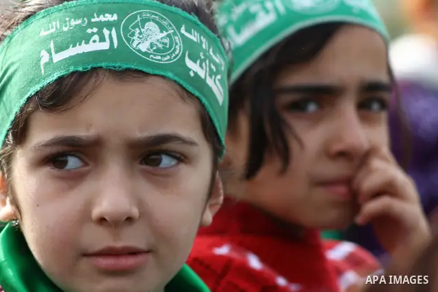 Thousands of Hamas supporters gather to celebrating marking the Islamist movement's 24nd anniversary at el-Qatiba yard in Gaza city on Dec 14, 2011. the Islamist movement of Hamas take over ruling at Gaza strip since Jun...