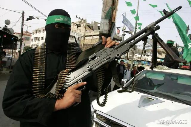 Palestinian Hamas militants patrol in the streets during the celebrations marking the Islamist movement's 24th founding anniversary, in the Rafah refugee camp in the southern Gaza Strip on December 14, 2011. Photo by Abe...