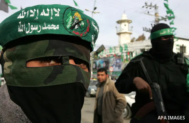 Palestinian Hamas militants patrol in the streets during the celebrations marking the Islamist movement's 24th founding anniversary, in the Rafah refugee camp in the southern Gaza Strip on December 14, 2011. Photo by Abe...