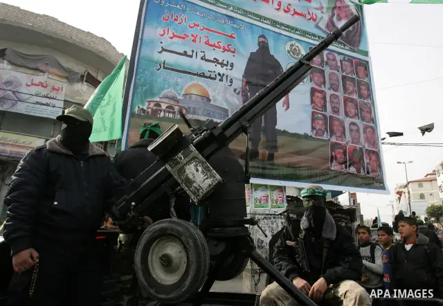 Palestinian Hamas militants patrol in the streets during the celebrations marking the Islamist movement's 24th founding anniversary, in the Rafah refugee camp in the southern Gaza Strip on December 14, 2011. Photo by Abe...