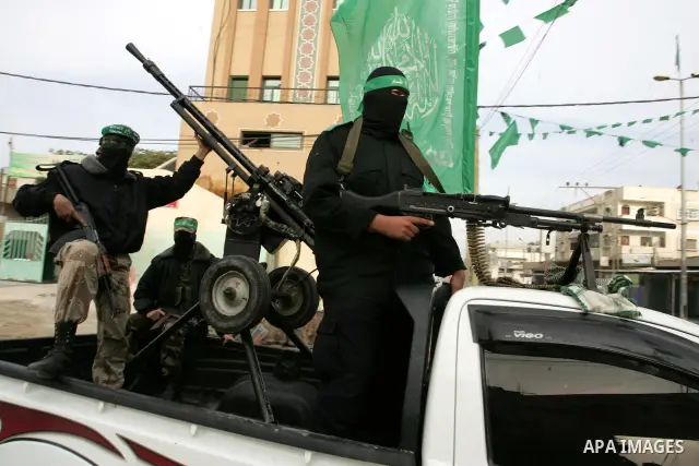 Palestinian Hamas militants patrol in the streets during the celebrations marking the Islamist movement's 24th founding anniversary, in the Rafah refugee camp in the southern Gaza Strip on December 14, 2011. Photo by Abe...