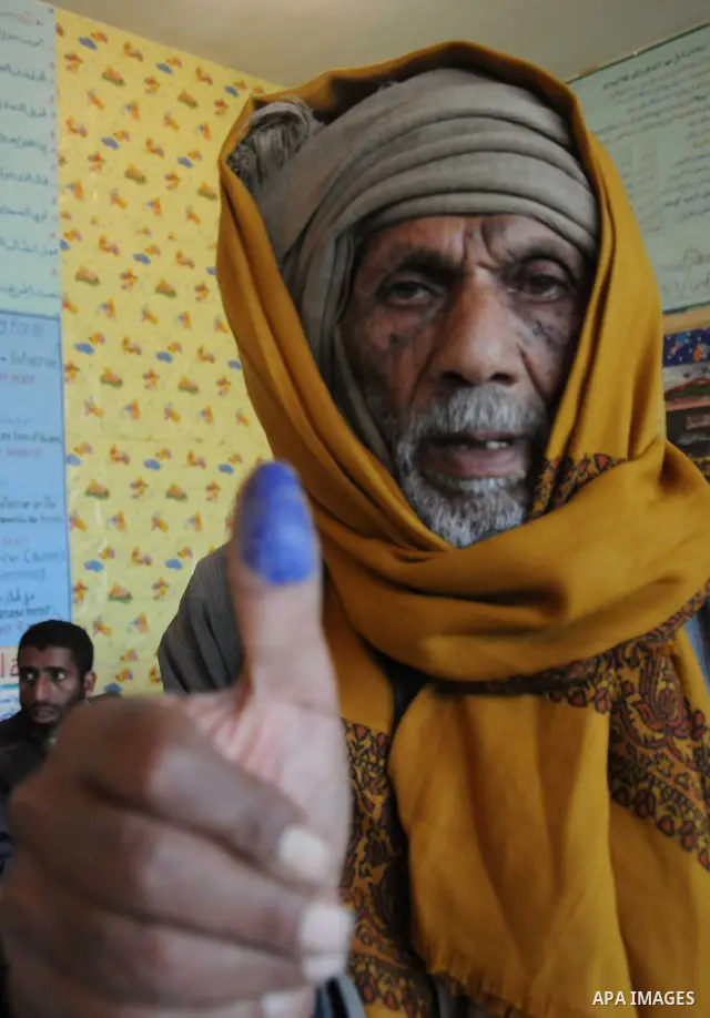 An Egyptian man shows his ink-stained finger after he voted at a polling station in Giza, southwest of Cairo, on December 14, 2011, during the second stage of Egypt's parliamentary elections. Some 18.8 million Egyptians...