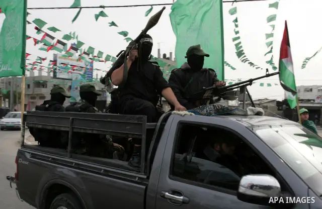 Palestinian Hamas militants patrol in the streets during the celebrations marking the Islamist movement's 24th founding anniversary, in the Rafah refugee camp in the southern Gaza Strip on December 14, 2011. Photo by Abe...