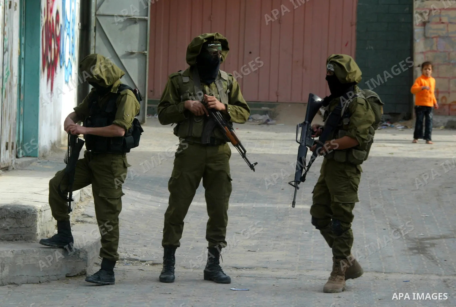 Palestinian Hamas militants patrol in the streets during the celebrations marking the Islamist movement's 24th founding anniversary, in the Rafah refugee camp in the southern Gaza Strip on December 14, 2011. Photo by Abe...