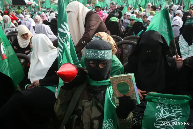 Thousands of Hamas supporters gather to celebrating marking the Islamist movement's 24nd anniversary at el-Qatiba yard in Gaza city on Dec 14, 2011. the Islamist movement of Hamas take over ruling at Gaza strip since Jun...
