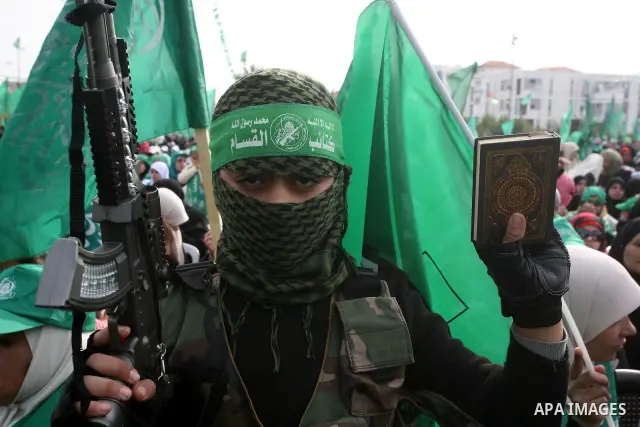 Thousands of Hamas supporters gather to celebrating marking the Islamist movement's 24nd anniversary at el-Qatiba yard in Gaza city on Dec 14, 2011. the Islamist movement of Hamas take over ruling at Gaza strip since Jun...