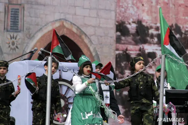 Thousands of Hamas supporters gather to celebrating marking the Islamist movement's 24nd anniversary at el-Qatiba yard in Gaza city on Dec 14, 2011. the Islamist movement of Hamas take over ruling at Gaza strip since Jun...