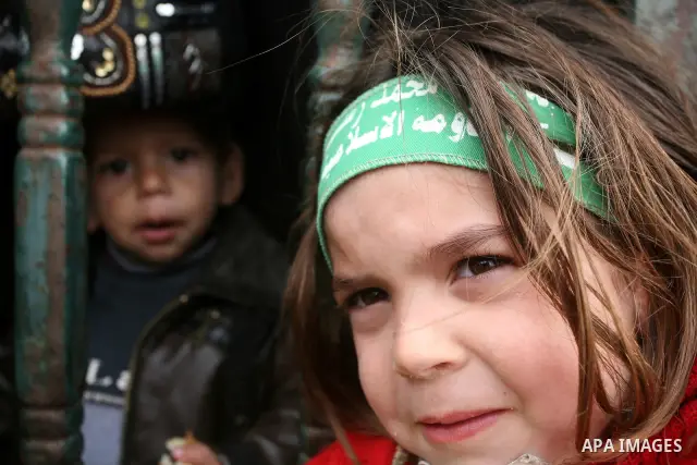 Thousands of Hamas supporters gather to celebrating marking the Islamist movement's 24nd anniversary at el-Qatiba yard in Gaza city on Dec 14, 2011. the Islamist movement of Hamas take over ruling at Gaza strip since Jun...