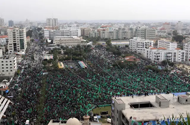 Thousands of Palestinian supporters of Hamas wave the Islamist movement's flags during celebrations for the 24th anniversary of its foundation in Gaza City on December 14, 2011. Photo by Mohammed Asad