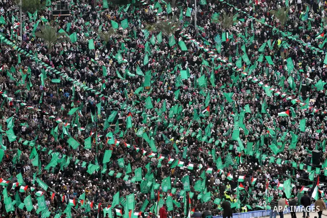 Thousands of Palestinian supporters of Hamas wave the Islamist movement's flags during celebrations for the 24th anniversary of its foundation in Gaza City on December 14, 2011. Photo by Mohammed Asad