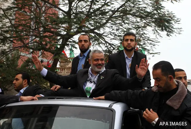 Palestinian prime minister in Gaza Strip, Ismail Haniya waves at the Islamist Hamas movement's supporters as they gather in Gaza City to celebrate the 24th anniversary of its foundation on December 14, 2011. Photo by Ash...