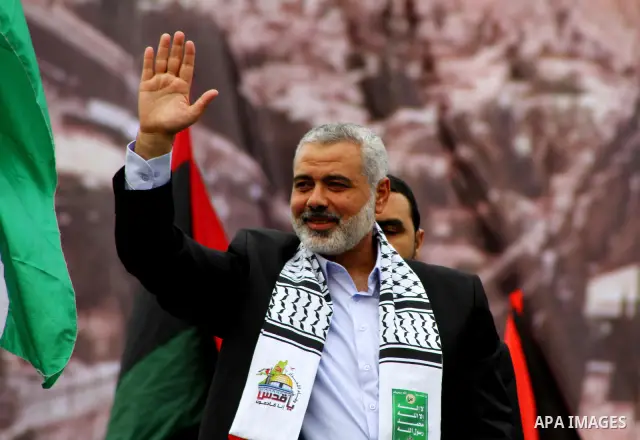 Palestinian prime minister in Gaza Strip, Ismail Haniya waves at the Islamist Hamas movement's supporters as they gather in Gaza City to celebrate the 24th anniversary of its foundation on December 14, 2011. Photo by Ash...