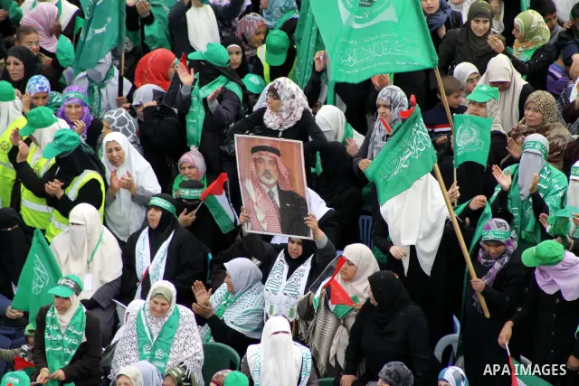 Thousands of Palestinian supporters of Hamas wave the Islamist movement's flags during celebrations for the 24th anniversary of its foundation in Gaza City on December 14, 2011. Photo by Ashraf Amra