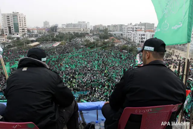 Thousands of Palestinian supporters of Hamas wave the Islamist movement's flags during celebrations for the 24th anniversary of its foundation in Gaza City on December 14, 2011. Photo by Ashraf Amra