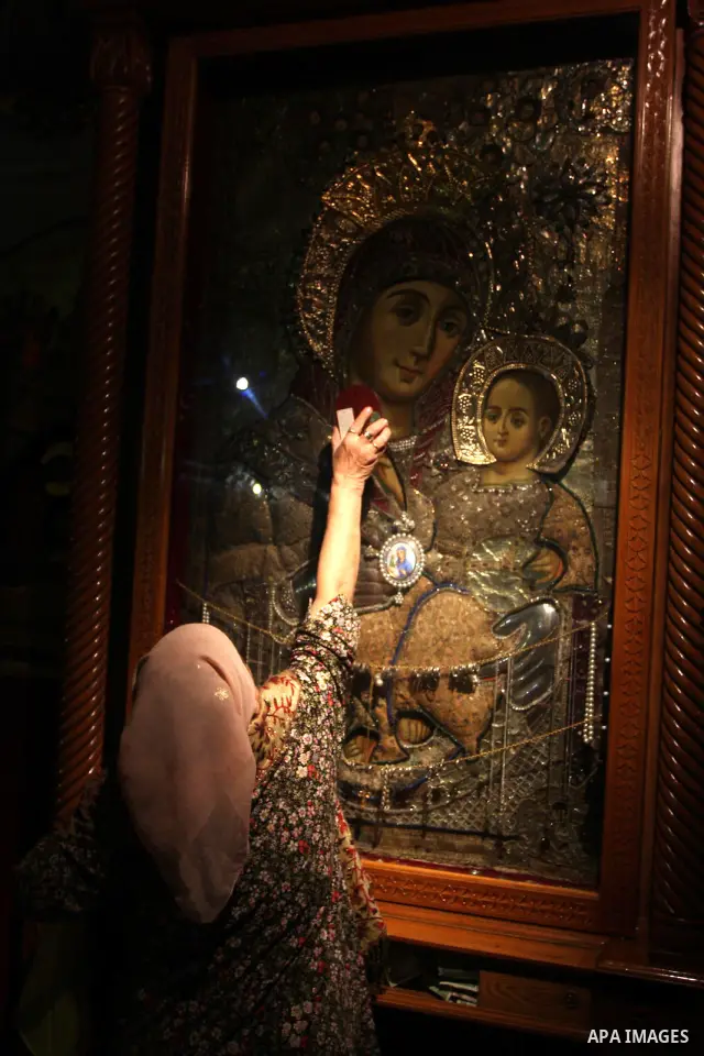 A Christian worshipper prays in the Church of the Nativity, the site revered as the birthplace of Jesus, in the West Bank town of Bethlehem December 15, 2011, ahead of Christmas. Christian worshippers began their spiritu...