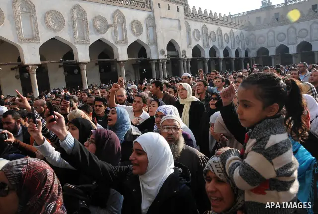 People at Al Azhar attend the funeral of Emad Effat, a senior official of Egypt's Dar al-Iftah who died in recent clashes, in Cairo December 17, 2011. Effat's wife Nashwa Abel-Fattah, told Reuters he died from a gunshot...