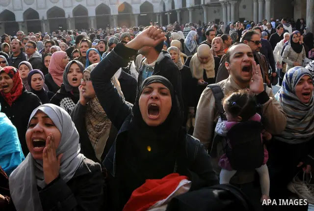 People at Al Azhar attend the funeral of Emad Effat, a senior official of Egypt's Dar al-Iftah who died in recent clashes, in Cairo December 17, 2011. Effat's wife Nashwa Abel-Fattah, told Reuters he died from a gunshot...