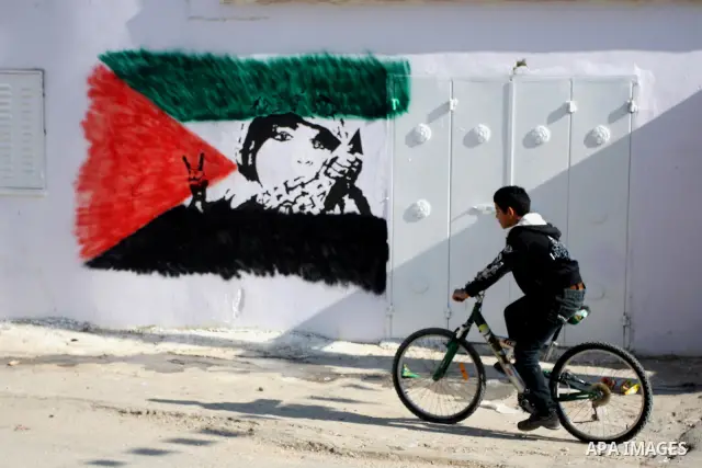 Palestinian relatives of prisoner Younis Jahjouh decorate the street ahead of his release from Israeli prisons in the Qalandia refugee camp near the West Bank city of Ramallah, Saturday, Dec 17, 2011. Israel is set to re...