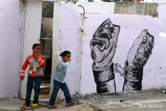 Palestinian relatives of prisoner Younis Jahjouh decorate the street ahead of his release from Israeli prisons in the Qalandia refugee camp near the West Bank city of Ramallah, Saturday, Dec 17, 2011. Israel is set to re...