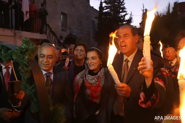 Palestinian Prime Minister Salam Fayyad attends the Christmas tree lighting celebration in the West Bank town of Beit Shour, near Bethlehem, on Dec. 17, 2011. Photo by Mustafa Abu Dayeh