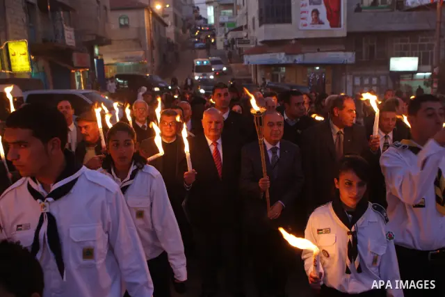 Palestinian Prime Minister Salam Fayyad attends the Christmas tree lighting celebration in the West Bank town of Beit Shour, near Bethlehem, on Dec. 17, 2011. Photo by Mustafa Abu Dayeh