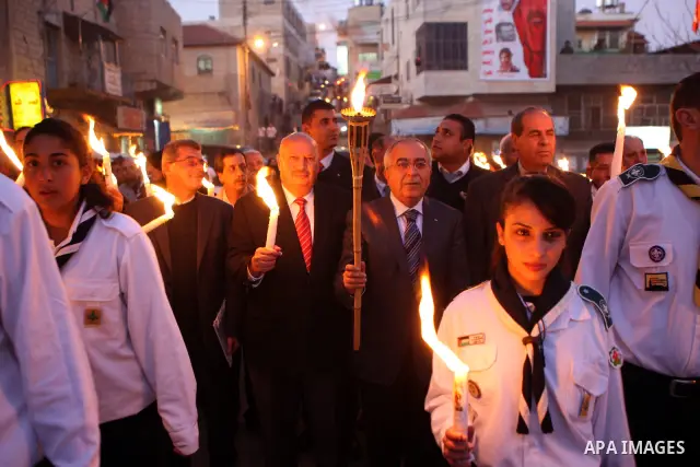 Palestinian Prime Minister Salam Fayyad attends the Christmas tree lighting celebration in the West Bank town of Beit Shour, near Bethlehem, on Dec. 17, 2011. Photo by Mustafa Abu Dayeh