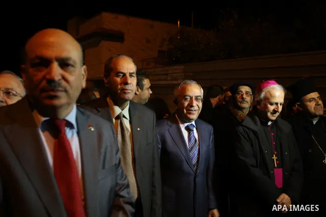Palestinian Prime Minister Salam Fayyad attends the Christmas tree lighting celebration in the West Bank town of Beit Shour, near Bethlehem, on Dec. 17, 2011. Photo by Mustafa Abu Dayeh